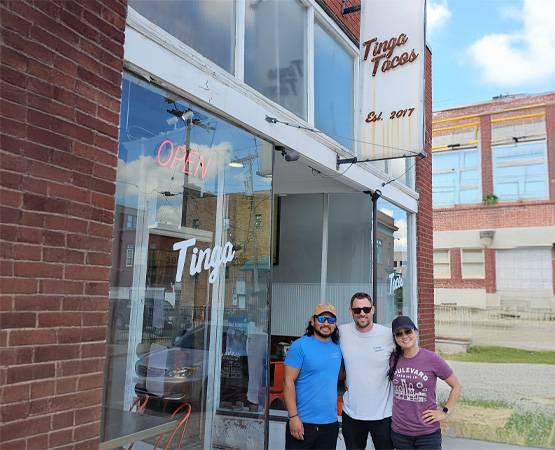 Tinga-owners-with-sign